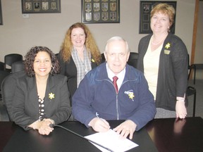 Mayor Bob Kilger signed a proclamation on Monday, designating April as Daffodil Month in Cornwall. On hand for the event were Coun. Bernadette Clement and Sharyn Duffy and Carolyn Bourassa, from the Canadian Cancer Society's local branch.
Staff photo/CHERYL BRINK