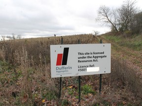 A sign marks the land where Dufferin Aggregates is expected to open a sand and gravel pit along West River Road South, near the intersection of Watts Pond Road, north of Paris. (MICHAEL PEELING, QMI Agency)