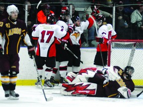 Casselman Vikings players including Erik Just (17) celebrate one of the team's goals in their 6-2 game five win over the Athens Aeros on Tuesday night, as dejected Aeros goalie Erik Miksik, defenceman Alex MacLean (23) and forward David Empey (22) look on. SUBMITTED PHOTO BY PHIL KALL