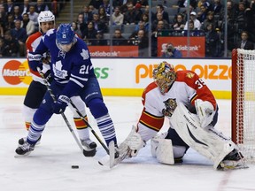 Toronto Maple Leafs' James van Riemsdyk (21) tries to score past Florida Panthers goalie Jacob Markstrom (R) and Filip Kuba (L) during the second period of their NHL hockey game in Toronto March 26, 2013. (MARK BLINCH/ Reuters)