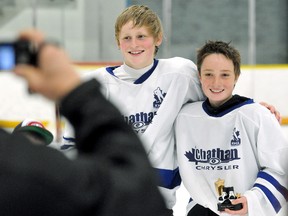 Maple Leafs' Liam Miller, right, and James Brophy pose for photos after winning the bantam championship at the Kent Minor Hockey Association's Day of Champs on Saturday at Thames Campus Arena. (MARK MALONE/The Daily News)