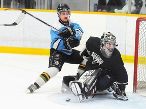 Team Foote's Evan Jacques makes a big save on Team Hilton's Chris Lemag during Team Hilton's 3-0 win in the 'A' final at Saturday's Sonny Harrison Memorial Last Chance Tournament at the Community Gardens.