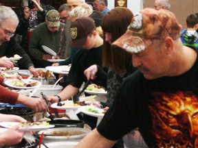 Diners fill their plates with moose, goose, deer, elk and more at the annual Dunvegan Fish and Game Association Wild Game Banquet