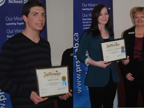 Brett Laue and Michelle Gordon with the certificate they received from Peace River School Division in recognition of perfect scores on their Math 30 Diploma exams, Nan Bartlett PRSD board chair presenting.