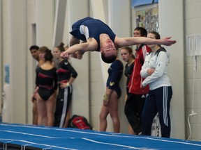 Airdrie Edge gymnast Mark Armstrong tumbles his way to first place in the national open power tumbling event at Genesis Place on Sunday.

JAMES EMERY/AIRDRIE ECHO