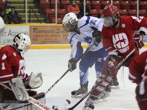 A player from the North East Midget AA hockey club crashes the net of the Notre Dame Hounds during their 2-2 tie at the Northern Lights Palace on Tuesday, March 26.