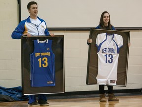 Bert Church High School students Curtis Contenti (left) and Sarah Abbott show off the school’s new customized, limited-edition jerseys they will receive for winning Finding Undeniable by Under Armour. The school will get $100,000 for winning the competition. 
PHOTOS BY JUSTINE KIMODEN/FOR THE AIRDRIE ECHO