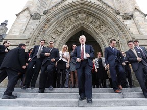 Interim Liberal leader Bob Rae (C) arrives for a group photo on the front steps of Centre Block on Parliament Hill in Ottawa March 27, 2013. (REUTERS/Chris Wattie)