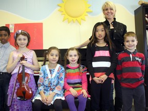 The introductory division is full of talent, including, from left, Harnan Mylvaganam, Emmanuelle Martin, Daphne Labelle, Anne-Sophie Labelle, Jaida St. Pierre, piano teacher Dawne Carrier, and Dario Kratofil. Martin and Ava Miller (absent) were awarded the Sally Pigeon Scholarship for strings, while the rest were awarded the Dr. Lou Ann Visctoni Scholarship for piano.
