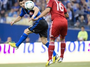 Toronto FC's Darel Russell enters into a 50-50 challenge with Montreal's Felipe during the club's last MLS match two week's ago.