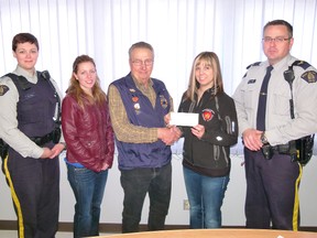 The Fairview Lions presented a cheque for $2,500 to Fairview and district Victim Services Unit. Left to right, RCMP Cst. Melissa Kelsey, Victim services Michelle Howes, Lion Ed Lueken, Victim Services Linda Moffatt and RCMP Corp. Brad Giles.