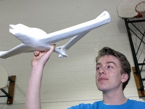 Cove McConnell shows off his model airplane at the 2013 Frontenac, Lennox and Addington Science Fair and McArthur Hall on Queen's University West Campus on Wednesday.
Ian MacAlpine The Whig-Standard