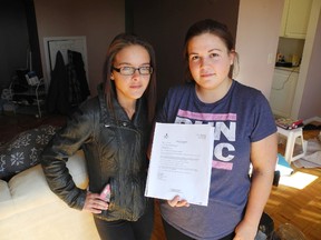Students Marissa Bryson, 22, left, and Cassie Hietala, 23, say poor maintenance by their building owner is forcing them to move from their apartment.                                
Elliot Ferguson The Whig-Standard