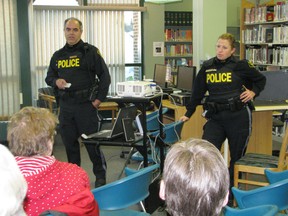 OPP Constables Dave Cain and Ronni Grosenick introduce parents and grandparents to the wonderful if sometimes scary world of social media during their Surviving Facebook presentation at Kenora Public Library, Tuesday evening, March 26.