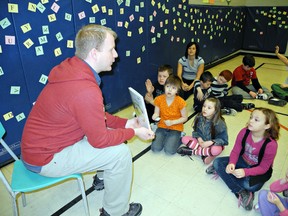 MICHELLE RUBY, The Expositor

James Cottam, an instructional coach for the Grand Erie District School Board, is one of several guest readers who shared books with students at Graham Bell-Victoria School on Wednesday at the school's first Literacy Carnival.