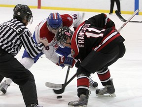Brandon Francisco of the Newmarket Hurricanes and Graham Yeo of the Kingston Voyageurs face off in the Voyageurs’ end during the opening game of the Ontario Junior Hockey League North-East Conference final at the Invista Centre Wednesday night. (Laura Boudreau/For QMI Agency)
