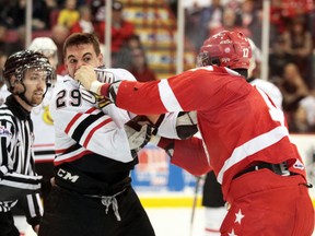 Hounds forward David Broll (right) dukes it out with Owen Sound's Kurtis Gabriel during OHL action at Essar Centre....Rachele Labrecque/Sault Star