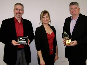 Chris Hawksworth, (left) was announced as the 2012 United Way of Sarnia-Lambton Volunteer of the Year while Randy Alwood of Pembina, (right), accepts the Day of Caring Award from United Way Community Investment and Finance Director Pamela Bodkin.