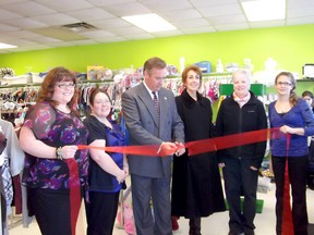 From left: Laurie Caouette, Amanda Scott (representing the store's various featured mompreneurs), Mayor Mark Walas, DBIA Chair Anna Thomson, Coun. Emily Rowley and Sarah Turney, at the grand opening Saturday.