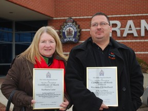 Barb Lane and Raymond Brouillard were recognized by the Brantford Police Services Board on Thursday with a certificate of merit. The certificate is presented to people who have helped Brantford police through putting themselves at personal risk or inconvenience.