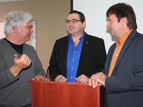 Fred Hahn, Ontario president of Canadian Union of Public Employees, from left, chats with Henri Giroux, CUPE’s Northern Ontario regional representative, and Charles Fleury, CUPE’s national secretary-treasurer, at Microtel in Timmins Thursday. The union leaders were in Timmins to help establish a CUPE council for this district.
