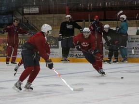 Graham Pickard makes a pass up the ice to Justin Schneeberger during Trappers practice at the Memorial Gardens on Thursday afternoon in preparation for North Bay's semi-final playoff series versus the Kirkland Lake Gold Miners. The series starts Saturday at the Memorial Gardens at 7 p.m. and game two will take place on Sunday at 7 p.m. at the Gardens.