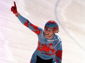 Canada's Tanya Dubnicoff waves to the crowd after winning the 500m cycling event at the Pan American Games July 28, 1999. Dubnicoff finished with a time of 35.394. (REUTERS)