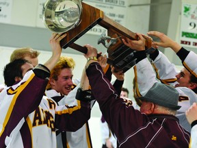 Jubilant Athens Aeros players and executives hoist the John Shorey Cup after the team downed the Casselman Vikings 3-1 on Thursday night at Centre 76 to capture the Rideau-St.Lawrence Conference Jr. B title. (STEVE PETTIBONE The Recorder and Times)