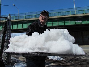 Ted Hallin-Williamson helps shovel snow all around his neighbourhood.