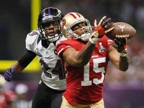 San Francisco 49ers wide receiver Michael Crabtree (15) is unable to hang onto a pass against Baltimore Ravens cornerback Corey Graham (24) in the third quarter in the NFL Super Bowl XLVII football game in New Orleans, Louisiana, February 3, 2013. (REUTERS)