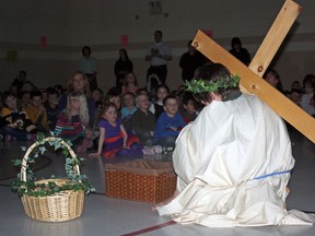 Students at Sacred Heart Catholic School in Timmins took part in the Stations of the Cross for Easter on Thursday. Parker Gvozdanovic was selected to carry the cross for the religious activity.