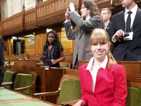 Shannon Payne, 18, a Grade 12 Ursuline College Chatham student, is pictured here sitting in Prime Minister Stephen Harper's place in the House of Common, while taking part in the Forum for Young Canadians, held in Ottawa, Ont. Undated photo.
CONTRIBUTED/ THE CHATHAM DAILY NEWS/ QMI AGENCY