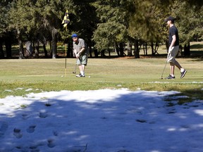 Gary Greenwood, left, and Brandon Murphy at East Park Golf Course in London. (Free Press file photo)