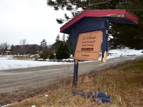 A broken sign points to an empty parking lot at the Talisman Resort in a photograph taken last February.