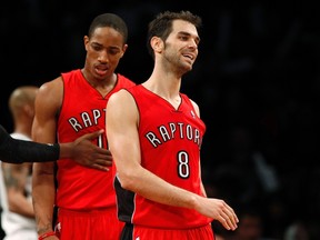 Toronto Raptors point guard Jose Calderon (R) and Toronto Raptors guard DeMar DeRozan react against the Brooklyn Nets in the fourth quarter of their NBA basketball game in New York, January 15, 2013. (REUTERS/Adam Hunger)