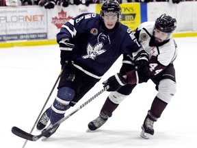 London Nationals' Matt Fuller, left, protects the puck from Chatham Maroons' Alexander Morgan in Game 1 of the GOJHL Western Conference final Thursday at Memorial Arena. (DIANA MARTIN/The Daily News)