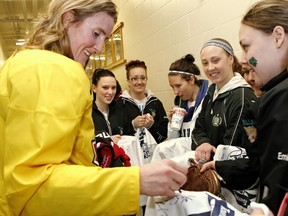 Hockey star Hayley Wickenheiser signs autographs for fans following a training camp session at CFB Petawawa for Canada's National Women's Team in advance of the 2013 IIHF Ice Hockey Women's World Championship taking place in Ottawa.Errol McGihon/Ottawa Sun