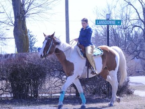 The weather was so nice Saturday that Lindsey Taylor of Delhi took her horse for a stroll through town. (MONTE SONNENBERG Simcoe Reformer)