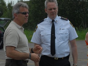Marcel Provenzano, chief of Sault Ste. Marie Fire Services, and Bob Davies, former chief of Sault Ste. Marie Police Service, speak at a community event in June 2012.