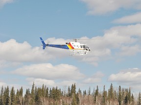 The RCMP helicopter flies over the Athabasca River near the boat launch to help with the search for a missing snowmobiler on Sunday, March 31. Late Saturday night at about 11:30 p.m. on March 30, two snowmobilers fell into the Athabasca River. One person is deceased while the second snowmbilier is still missing.
Barry Kerton | Whitecourt Star