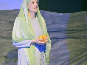 Portager Terrie Todd dramatizes the role of Mary Magdalene during a Good Friday drama at Portage Alliance Church. She asks the question, "Where was God?" when His son, Jesus Christ, was crucified on a cross.
(CLARISE KLASSEN/THE GRAPHIC/QMI AGENCY)