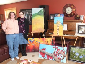 KEVIN RUSHWORTH HIGH RIVER TIMES. Karon Argue, at right, and her friend Lee-Anne Murakami ahead of their Into the Wild art show, which is held April 6 at the High River Culture Centre.