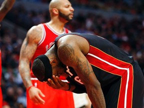 Miami's LeBron James holds his head during the Heat's game against the Bulls. (REUTERS)