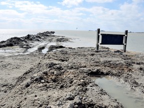 Mounds of what appear to be a portion of the approximately 5,800 cubic metres of fill dredged from the Mitchell's Bay marina channel stretch into Lake St. Clair. PHOTO TAKEN Mitchell's Bay, On., Monday April 01, 2013. (DIANA MARTIN/ THE CHATHAM DAILY NEWS/ QMI AGENCY)