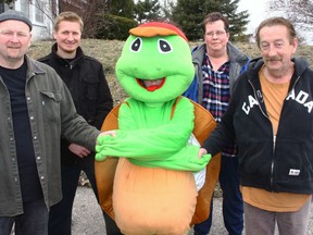 Turtlefest mascot George (centre) is pleased to welcome John Bamford, left of Bamford Homes Inc., and Les Anderson, Owner of Southern Ontario Printing Ltd. (right) aboard as title co-sponsors for an expanded 3rd Annual Turtlefest this Friday June 14 and Saturday, June 15. In the back, are Turtlefest Committee members Cephas Panschow and Suzanne Fleet. Jeff Tribe/Tillsonburg News