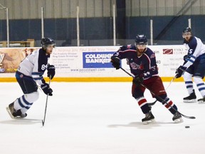 Holding back a bit in the first period, the Saugeen Shores Winterhawks stepped it up a notch winning 4-1 over the Elora Rocks in Game 6 of the series, taking the North division for the third straight year. Pictured is ‘Hawks player, Brendon Haefling protecting his net from a shot by Rocks player Jeremy O’Donnell.