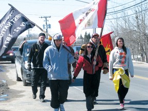 Youth for Lakes members joined by local supporters arrive in Kenora Monday to promote their clean water campaign. The group of about 12 aboriginal youth are taking their message to Ottawa where they expect to conclude their walk in mid-May. 
REG CLAYTON/Daily Miner and News