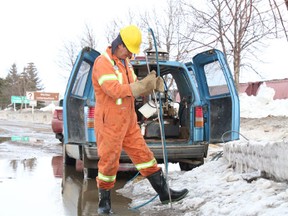 An employee from the City of Melfort worked on opening up a catch basin on Saskatchewan Avenue on Good Friday as preparations for the spring thaw continued.