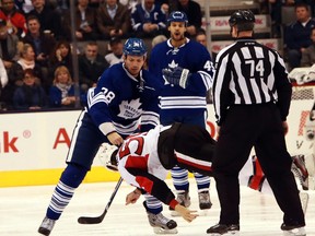 Toronto's Frazer McLaren puts Ottawa's Dave Dziurzynski to bed in a first-period scrap last month. Recent knockout blows have rehashed the endless debate surrounding fighting in hockey. (QMI Agency)