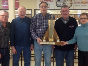 The six-day Joe Gubbels Funspiel at the McIntyre Curling Club is the annual season-ending tournament for the New Horizons Seniors’ Curling League. Ray Schizkoske, Timmins New Horizons president, centre, presented the Joe Gubbels Trophy to the winning team, the members of which are from left, Wayne Jaszen (lead), Richard Dickson (vice), Vic Rinaldi (skip) and Carmen Perrier (second).